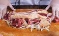 Chef preparing raw lamb chops for cooking separating the rack of lamb Royalty Free Stock Photo