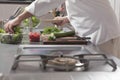 Chef Preparing Salad In Commercial Kitchen Royalty Free Stock Photo