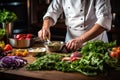 Chef preparing salad in the kitchen at the restaurant. Healthy food concept, A chef preparing a salad with fresh, organic Royalty Free Stock Photo