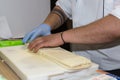 Chef Preparing Sandwiches on a Chopping Board