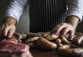 A chef preparing sausages food photography recipe idea