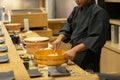 Asian Chef preparing sushi, Omakase style Japanese traditional. Royalty Free Stock Photo