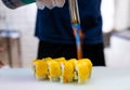 chef preparing sushi roll at restaurant kitchen, closeup of hands Royalty Free Stock Photo