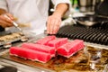 Chef preparing tuna steaks