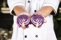 Chef presend piece of purple cabbage Royalty Free Stock Photo