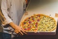 Chef presenting New York style pizzas takeout. Royalty Free Stock Photo