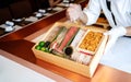 The chef presents the premium fresh ingredients in a wooden box before making the omakase meal.