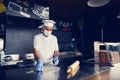 Chef  with protective coronavirus face mask preparing pizza Royalty Free Stock Photo