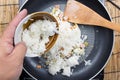 Chef put cooking rice to pan Royalty Free Stock Photo