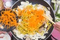 Chef put slice of carrot for cooking Yakisoba noodle Royalty Free Stock Photo