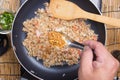 Chef putting braised leeks for cooking fried rice Royalty Free Stock Photo