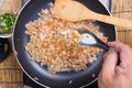 Chef putting braised leeks for cooking fried rice Royalty Free Stock Photo