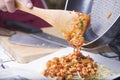 Chef putting chicken sauce to spaghetti on the plate Royalty Free Stock Photo