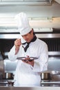 Chef putting chocolate sauce on a dessert Royalty Free Stock Photo