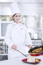 Chef Putting Food into Plate Royalty Free Stock Photo