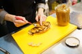 Chef putting pieces of foie on a piece of fried bread