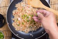 Chef putting slice of green onion for cooking fried rice Royalty Free Stock Photo