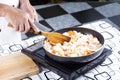 Chef putting slice pf pork to the pan for cooking Japanese pork Royalty Free Stock Photo