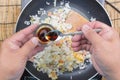 Chef putting soy sauce for cooking fried rice Royalty Free Stock Photo