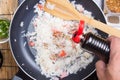 Chef putting soy sauce for cooking rice Royalty Free Stock Photo