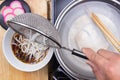Chef putting udon noodle to cup Royalty Free Stock Photo