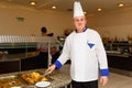 The chef of the restaurant of hotel Marvel poses in the workplace