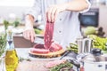 Chef cutting and cooking meat in the restaurant kitchen Royalty Free Stock Photo