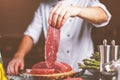 Chef cutting and cooking meat in the restaurant kitchen Royalty Free Stock Photo