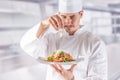 Chef in restaurant kitchen prepares and decorates meal with hands.Cook preparing spaghetti bolognese Royalty Free Stock Photo