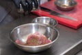 The chef in the restaurant marinates the chicken for the guests. Royalty Free Stock Photo