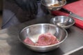 The chef in the restaurant marinates the chicken for the guests. Royalty Free Stock Photo