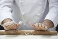 Chef Rolling Dough With Rollingpin