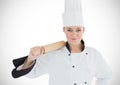 Chef with rolling pin against white background Royalty Free Stock Photo