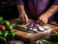 Chef\'s hands cutting vegetables on a wooden cutting board