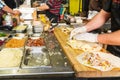 Chef`s hands preparing mexican tacos at a street food market, festival, event. Process cooking. Street food concept. Selective fo