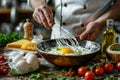 A chef s skilled hands whisk a bright yolk among herbs, prepping for an omelette Royalty Free Stock Photo