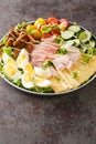 Chef salad is an American salad consisting of boiled eggs, more varieties of meat, tomatoes, cucumbers, and cheese, all placed