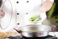 Chef scald vegetable in pot before cooking noodle Royalty Free Stock Photo