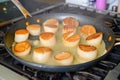 chef searing scallops in a nonstick pan