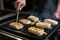 chef searing tofu steaks on a griddle Royalty Free Stock Photo