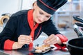 Chef seasoning an appetizer in kitchen Royalty Free Stock Photo