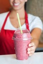 Chef serving strawberry milkshake