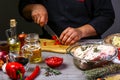Chef sharp chili on wooden table background. Bavarian pork knuckle cooking. Food homemade recipe concept