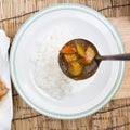 Chef shovel Japanese pork curry with steam rice