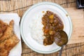 Chef shovel Japanese pork curry with steam rice