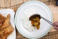 Chef shovel Japanese pork curry with steam rice