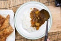 Chef shovel Japanese pork curry with steam rice