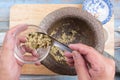 Chef shovel mince of coriander,pepper and garlic to cup