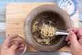 Chef shovel mince of coriander,pepper and garlic to cup