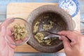 Chef shovel mince of coriander,pepper and garlic to cup